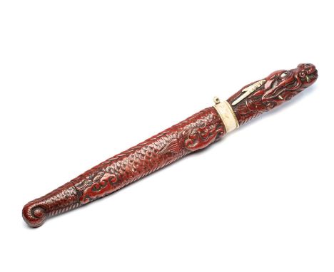 A JAPANESE RED LACQUER AND BONE MOUNTED TANTO DAGGER, MEIJI PERIOD (1868-1912) the single-edged blade enclosed and mounted wi