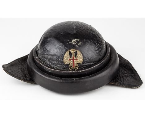 SPANISH MODEL 1935 TANKER HELMETBlack leather padded helmet, worn by tankers in Spain's post-civil war fascist army. At the f
