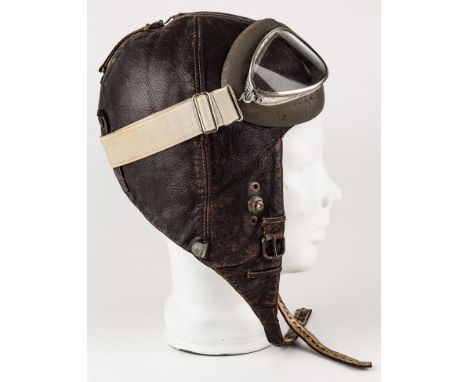 LUFTWAFFE FLIGHT HELMET WITH GOGGLESGerman Luftwaffe K33 winter flight helmet, constructed of brown leather with a white flee