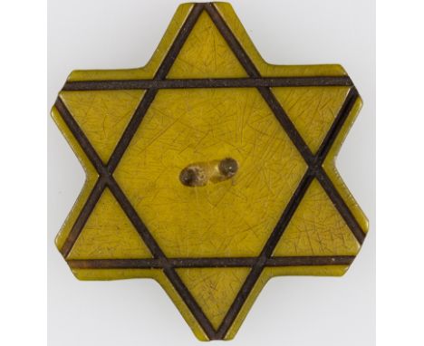 BULGARIAN JEW'S STAR OF DAVID BUTTONVery rare carved button, 1 1/4" dia., in the shape of a yellow Star of David. These butto