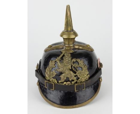 HESSIAN PICKELHAUBE HELMETWorld War I-era German "Pickelhaube", constructed of lacquered black leather, with a brass crucifor