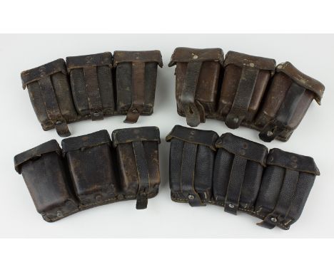 GERMAN AMMUNITION POUCHESLot of four German ammo puches, three K-98 of which two are unit-marked, along with a WWI pouch made