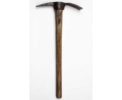 U.S. ARMY PICK AXEWood-handled pickaxe or mattock, 23 3/4" long, with a 12" steel head incorporating a pick at one end and a 