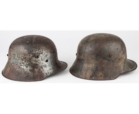 CAMOUFLAGE-PAINTED M1916/1917 STAHLHELM HELMETSPair of German steel M1916/1917 combat helmets, both bearing painted "tortoise