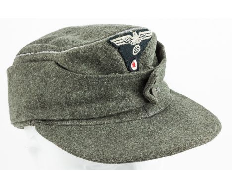 WEHRMACHT OFFICER'S M43 CAPM43 "bergmutze" cap, marked size 56 within the crown, constructed of grey-green wool with a green 