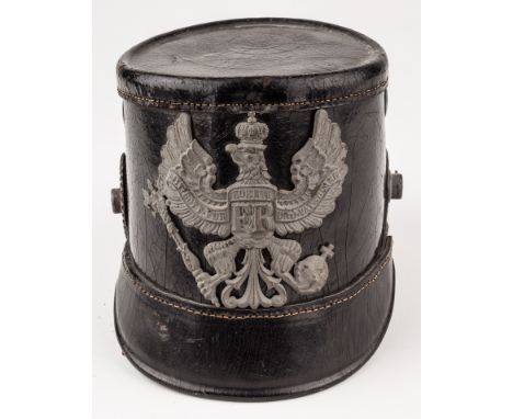 PRUSSIAN SHAKOImperial German enlisted man's shako, constructed of lacquered black leather, bearing a metal "wappen", or helm