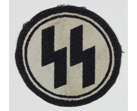SS CLOTH INSIGNIARound cloth SS patch, 3 3/4" diameter and clearly haveing been removed from an article of clothing, with clo