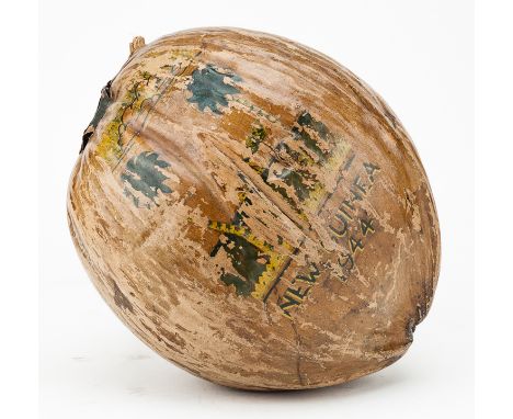 AMERICAN SOLDIER IN NEW GUINEA MAILS A COCONUT HOMEGenuine hand-painted coconut 9 ½" long, mailed by Army Warrant Officer Ell