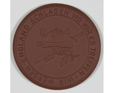 AFRIKA KORPS REMEMBRANCE MEDALLIONBrown porcelain table medal, 2" dia., reads (in German) on the front: "IN REMEMBRANCE OF TH