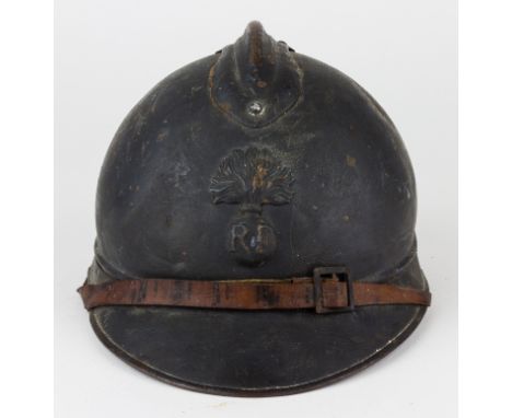 FRENCH M15 "ADRIAN" HELMETWorld War I-era M15 "Adrian" helmet, with a metal comb affixed to the crown with four pins, and wit