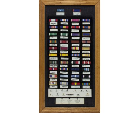 SERVICE RIBBON DISPLAYAttractive framed display of 42 service ribbons and 16 other pins and devices, from World War I through