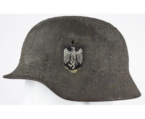 M40 HELMET WITH "ZIMMERIT" CAMOUFLAGEA true rarity, an German M40 single decal Heer helmet with hand-applied "zimmerit" camou