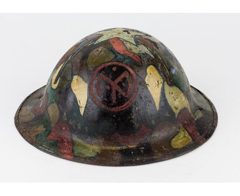 CAMOUFLAGE-PAINTED M1917 HELMET WITH 27TH INFANTRY INSIGNIAAmerican World War I-era steel M1817 helmet, painted with a bright