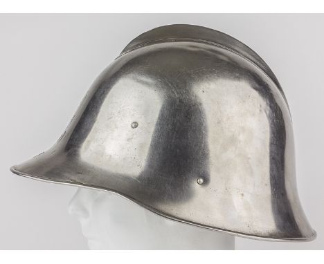 EUROPEAN PARADE OR FIRE HELMETSteel helmet of unknown origin, with a bright polished finish and a comb welded to the crown. N