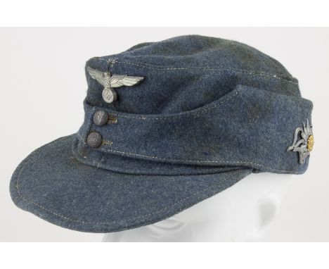 BAHNSCHUTZ M43 FIELD CAPGerman railway police ("Bahnschutz") M43 field cap constructed of gray wool. A metal national eagle i