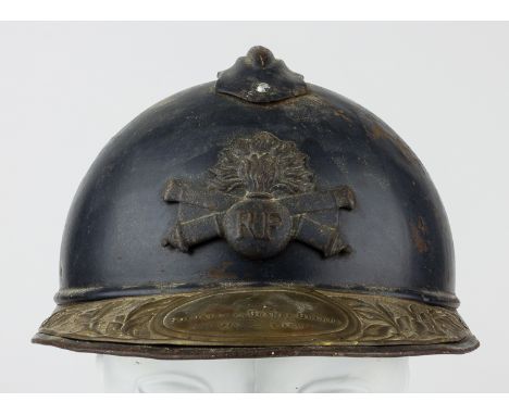 FRENCH M15 "ADRIAN" HELMET WITH COMMEMORATIVE PLAQUEWorld War I-era M15 "Adrian" helmet, with a metal comb affixed to the cro