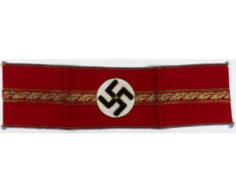 DEPUTY GAULEITER'S N.S.D.A.P. POLITICAL ARMBANDScarce Deputy Gauleiter party armband, red wool with four bands of gold metall