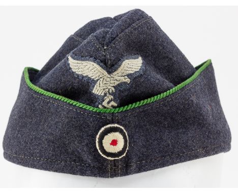 LUFTWAFFE OVERSEAS CAPEarly Luftwaffe enlisted man's overseas cap, 11" long in dark blue wool, piped in green braid (military