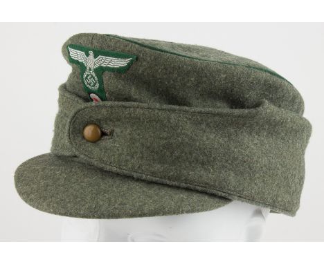 GERMAN CUSTOM'S OFFICER'S M43 CAPLand Customs ("Landzoll") officer's winter M43 cap. This "bergmutze" bears a gray-green body