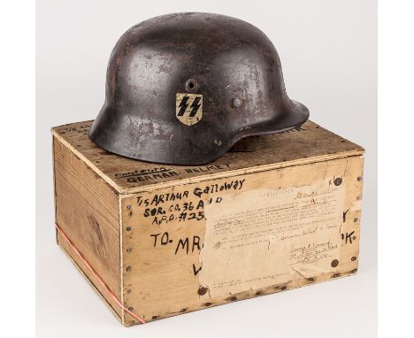 WAFFEN-SS HELMET WITH "BRING BACK" PAPER WORKGerman steel single-decal M1940 combat helmet, with a very dark green painted fi