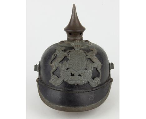 STUTTGART PICKELHAUBE, M/1915Black leather pickelhaube helmet with grey painted steel mounts; consisting of round spike base 