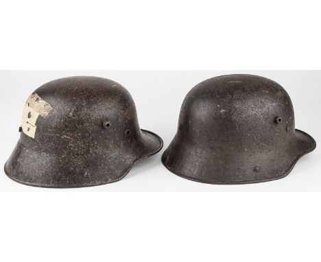 M1916/1917 STAHLHELM HELMETSPair of German steel M1916/1917 combat helmets, both in original finish, the first fitted with a 