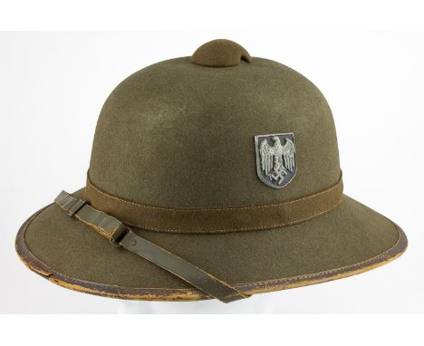 GERMAN TROPICAL SUN HELMETArmy tropical sun helmet ("tropenhelm") commonly used by the Afrika Korps. The helmet has a medium 