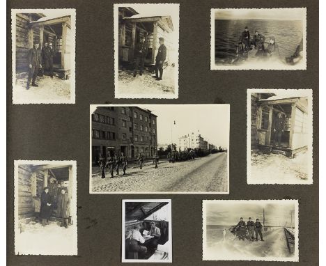 WEHRMACHT SOLDIER'S EASTERN FRONT PHOTO ALBUMCloth bound photo album, 44pp. 13 1/4" x 10 1/2", containing 230 b/w photographs