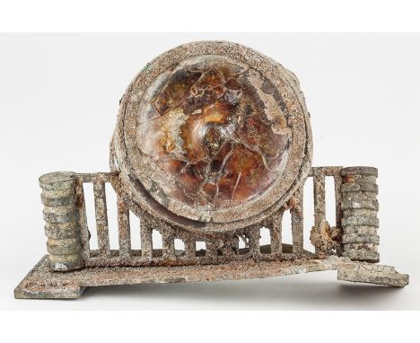 A BLAST-DAMAGED CLOCK FROM HIROSHIMAAn astounding relic recovered from near "ground zero" at Hiroshima, a mantle clock which 