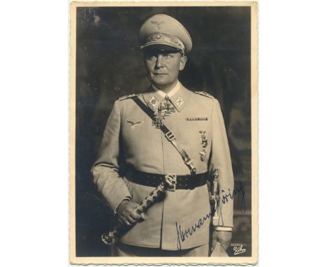 PHOTOS OF HERMANN GOERING, TAKEN FROM HIS HOME AT BERCHTESGADENPair of postcard photographs shopwing Hermann Goering in full 