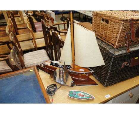 An Art Deco table lamp in the form of a boat, and another Art Deco table lamp in the form of a boat. Both sold as collectors 