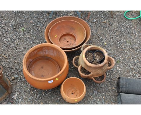 A quantity of various sized terracotta plant pots (some AF) and a terracotta strawberry planter 