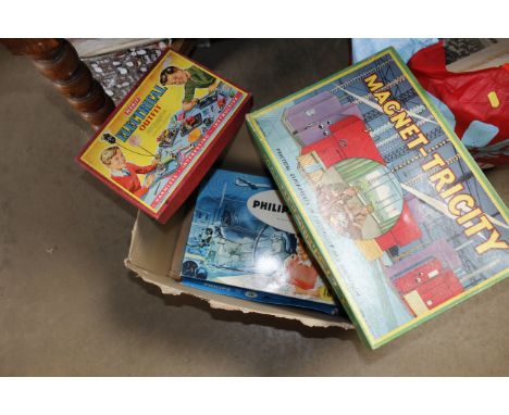 A box containing various children's vintage electrical sets including Magnet-Tricity