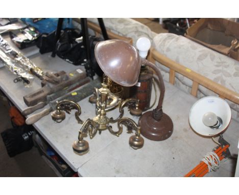 A metal ornate five branch ceiling light; an ornate table lamp; a further table lamp mounted to a wooden block and an adjusta