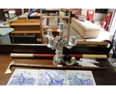 A German porcelain figural and floral encrusted candelabra AF, a digeridoo and a walking stick