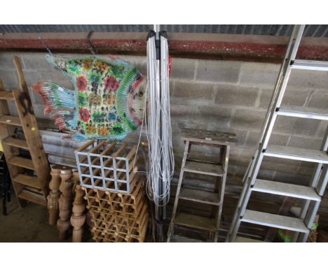 A rotary clothes airer; a garden digging fork; a walking stick etc. 