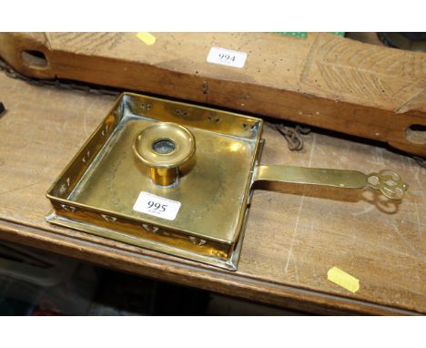 An Arts & Crafts type brass chamber stick
