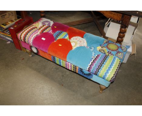 A button down upholstered stool