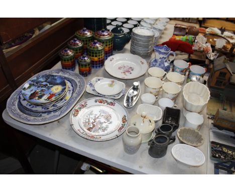 A set of six French enamel decorated storage jars, 19th Century floral decorated plate, cruet set in the form of a boat, a Ma