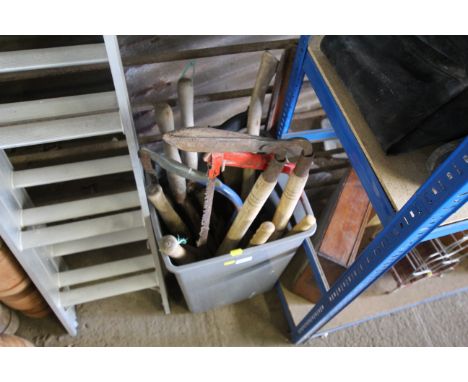 A plastic bin and quantity of wooden handled tools to include shears, bow saw, hand saw, loppers etc.