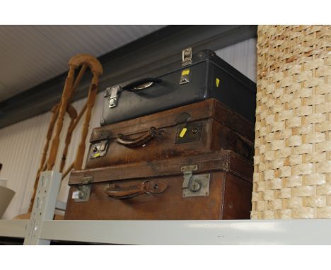 Two vintage leather cases and one other