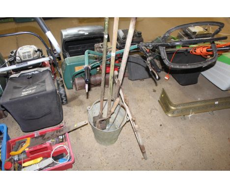 A galvanised bucket and contents of tools to include fork, hand held scythe, wooden framed bow saw, garden edger etc. 