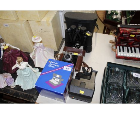 A Polaroid camera, a vintage camera and a pair of Mark Scheffell 20 x 50 binoculars