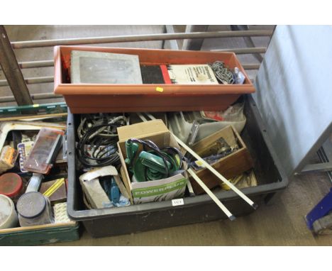 A large plastic crate and contents of various items to include garden sprayer with original box, metal plate brackets, plasti