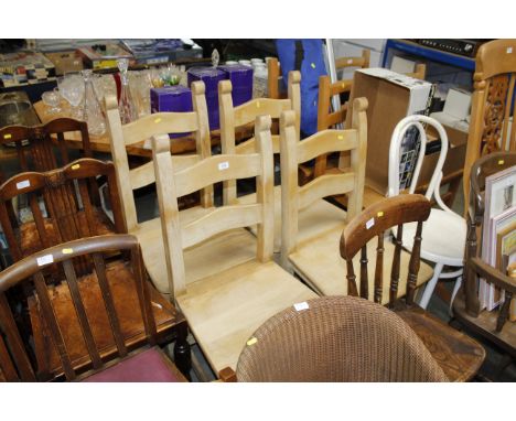 Four ladder back kitchen chairs