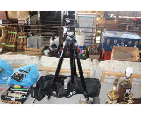 A Manfrotto telescopic tripod with carry bag and accessories