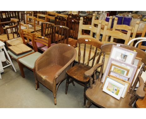 A spindle back elbow chair, an elm seated spindle back chair, a Loom chair, two ladder back chairs and two oak slat back chai
