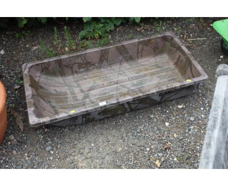 A plastic child's sledge with camouflage print 
