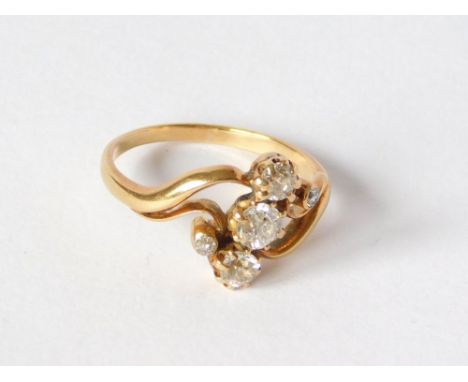 DIAMOND RING. An 18ct. gold ring set an arrangement of five diamonds. Size M/N. Approx. 3g.  Please note that all items in th