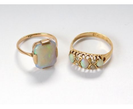 OPAL RINGS. An early 20th century three stone opal & four stone diamond ring, Chester 1915. Also, a 9ct. gold dress ring set 